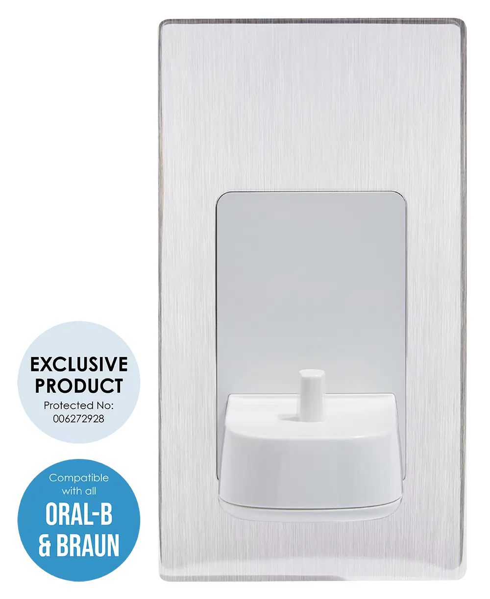 Proofvision - A sleek, wall-mounted electric toothbrush charger with a brushed metal finish. Two circular labels beside it indicate: "EXCLUSIVE PRODUCT Protected No: 006272928" and "Compatible with all ORAL-B & BRAUN.