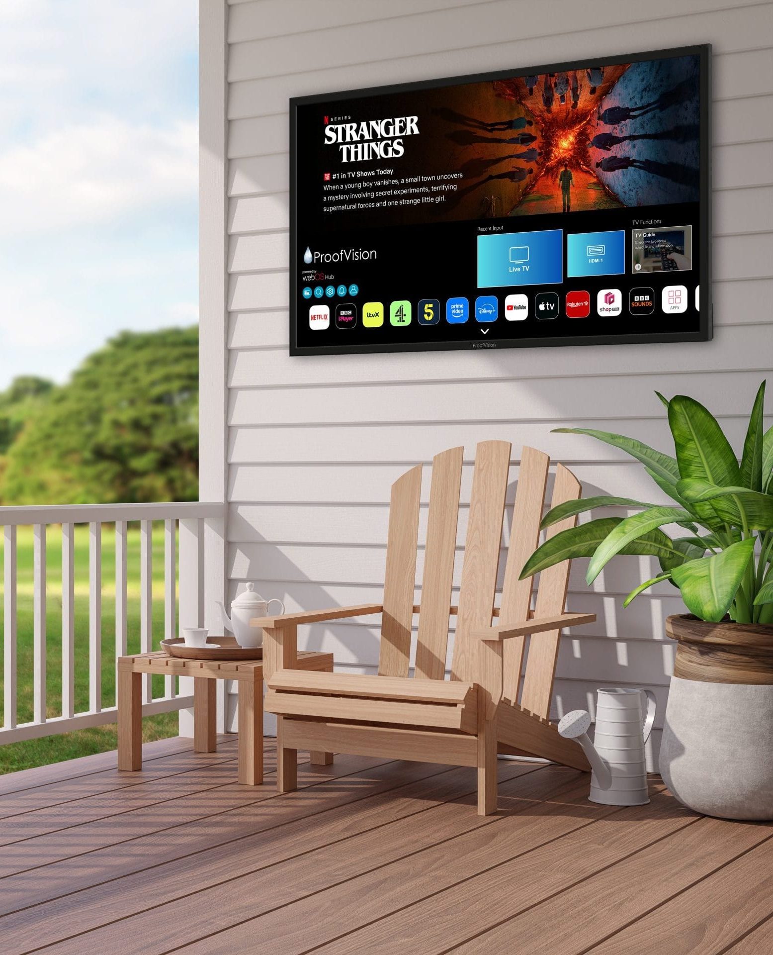 ProofVision Lifestyle Plus MX Outdoor TV mounted on white porch overlooking green garden landscape